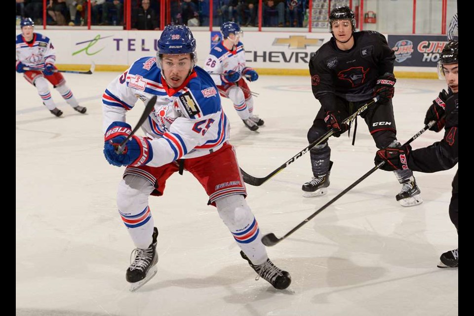 Sean Donaldson (#25) chases the puck for the Prince George Spruce Kings against the Brooks Bandits (via Hockey Canada/Matthew Murnaghan)