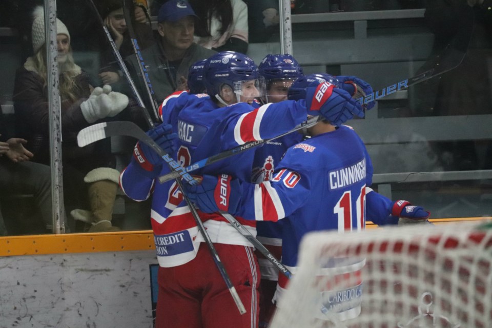 Prince George Spruce Kings huddle up after a goal against the Chilliwack Chiefs at the the Rolling Mix Concrete Arena (via Kyle Balzer)
