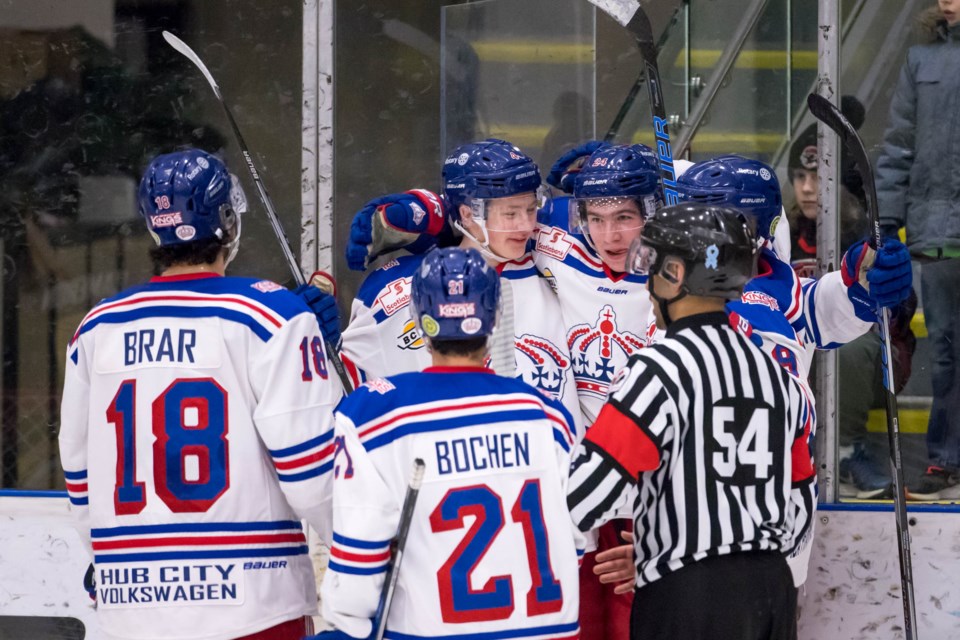 Prince George Spruce Kings celebrate a goal on the road against the Coquitlam Express (via Damon James Photography)