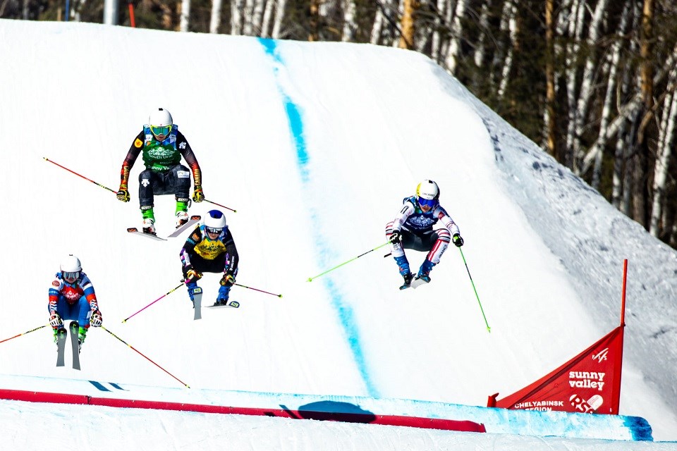 Tiana Gairns of Prince George (green bib, 2nd left) flies in first to win the small final of the FIS World Cup Ski Cross stop in Sunny Valley, Russia, resulting in a fifth-place overall finish on March 13, 2021.