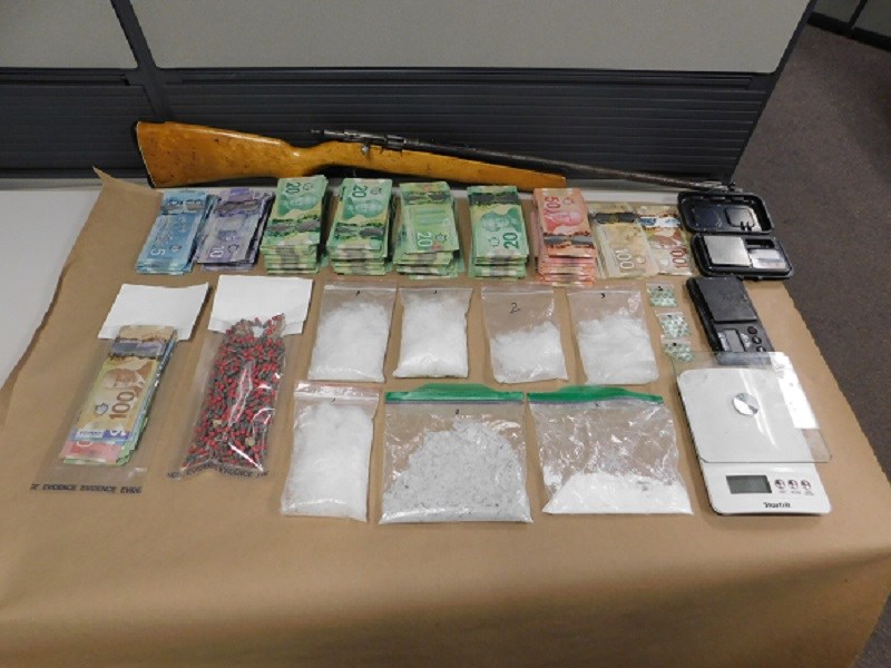 Drugs, cash and firearm during search warrant execution - Quesnel RCMP Aug. 3, 2020