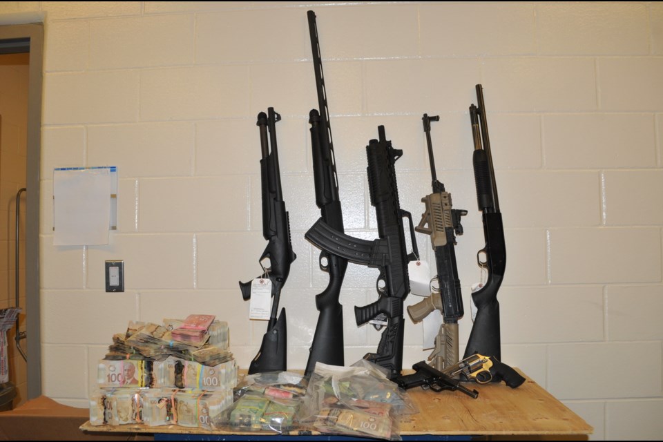 Guns and ammunition were taken from the residence. (via Prince George RCMP)