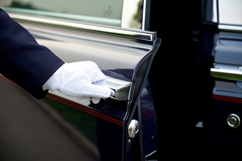 valet opening a car door