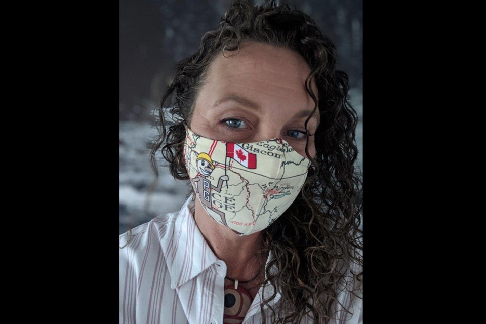 Prince George's Exploration Place has created face masks to help raise funds to support its Animal Ambassadors program in light of COVID-19, including one depicting Mr. PG seen here on CEO Tracy Calogheros. (via The Exploration Place)