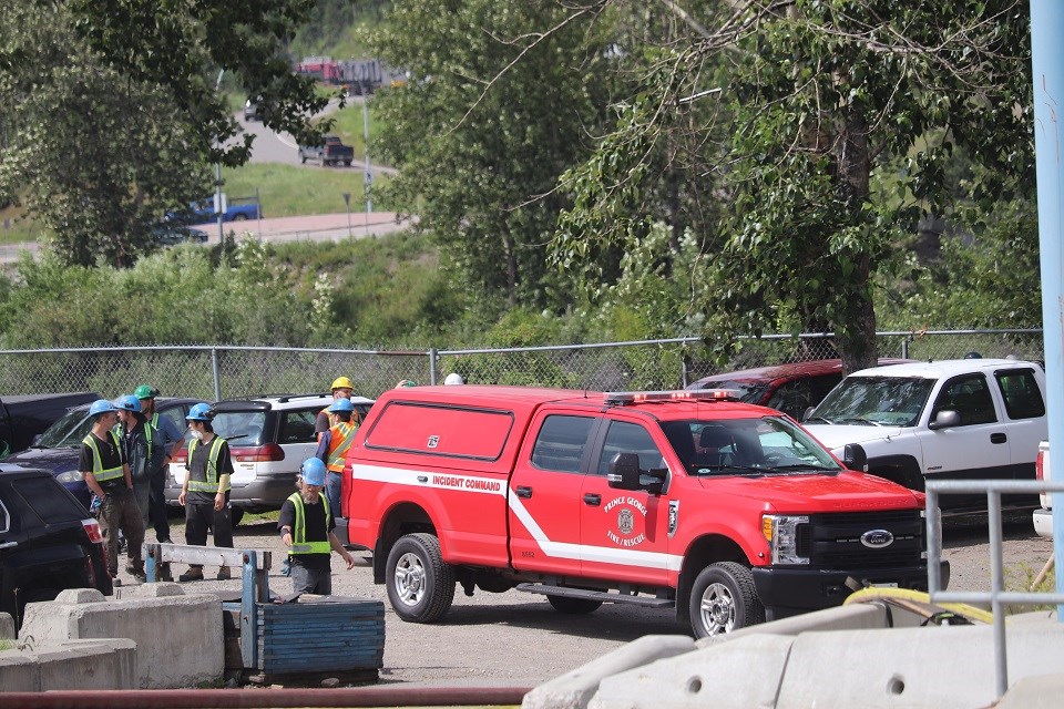 Brink Forest Products employees stand outside as Prince George Fire Rescue tends to incident on July 9, 2020. (via Kyle Balzer, PrinceGeorgeMatters)