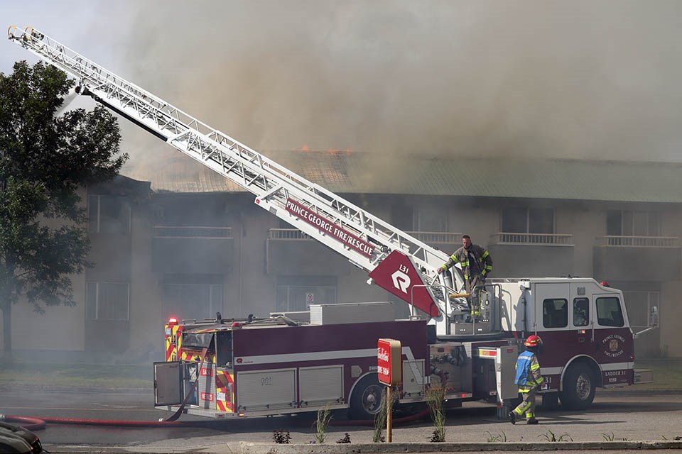 Prince George Fire Rescue crews battle a blaze engulfing the Econo Lodge near 15th Avenue and Victoria Street on July 8, 2020. (via Kyle Balzer, PrinceGeorgeMatters)