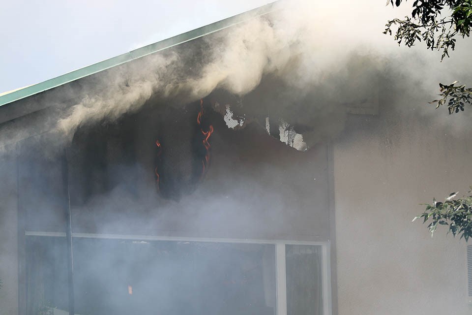 Prince George Fire Rescue crews battle a blaze engulfing the Econo Lodge near 15th Avenue and Victoria Street on July 8, 2020. (via Kyle Balzer, PrinceGeorgeMatters)