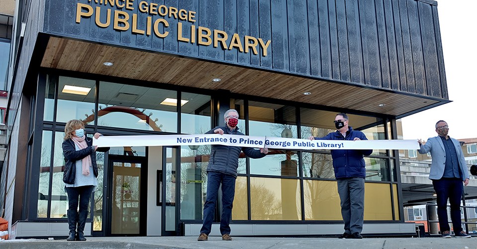 Prince George Public Library Board Member and City Councillor Terri McConnachie; Mayor Lyn Hall; Library Board Chair Mike Gagel; and Library Director Paul Burry at a ribbon-cutting ceremony held recently to mark the opening of the new Library entrance. (via City of Prince George)