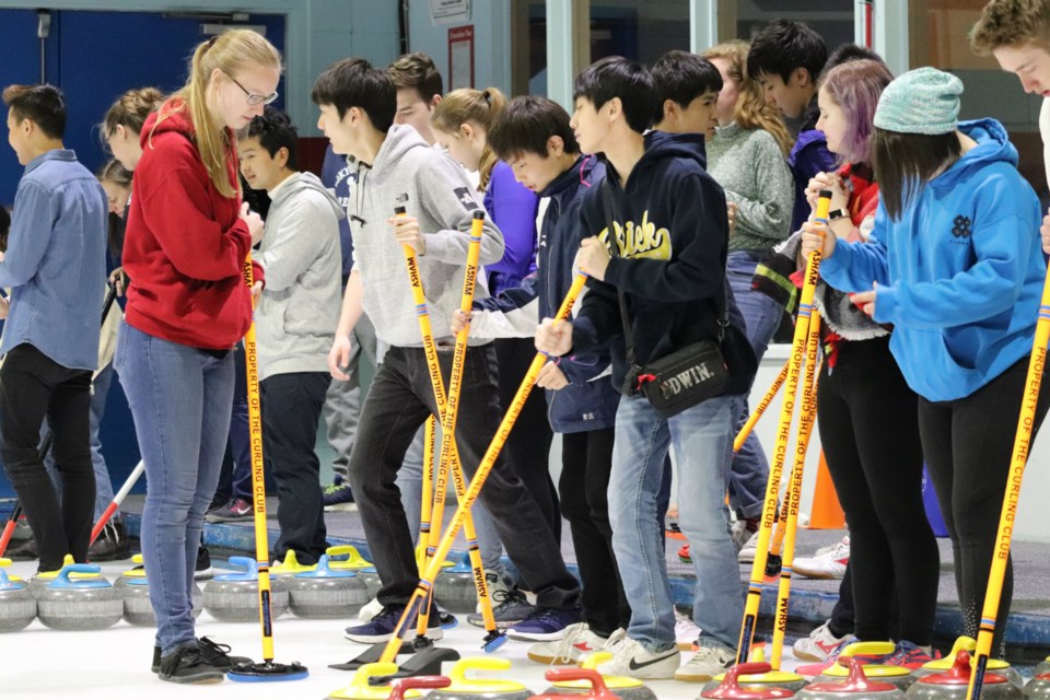 Getting ready to try curling for the first time are these Japanese exchange student from Tokyo (via Kyle Balzer)