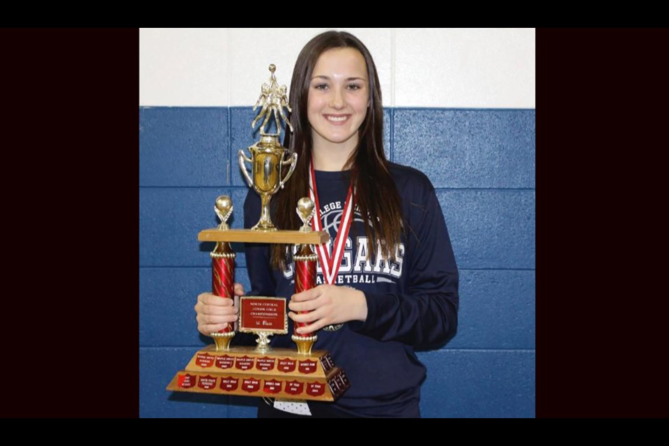 Jessica Nycholat of Prince George hoists the North Central Junior Girls Basketball trophy as a College Heights Cougar (via Facebook/Jessica Nycholat)