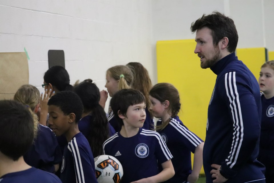 Vancouver Whitecaps Northern Academy Coach Austin Derksen preps his younger players for practice at UNBC's Northern Sport Centre (via Kyle Balzer)