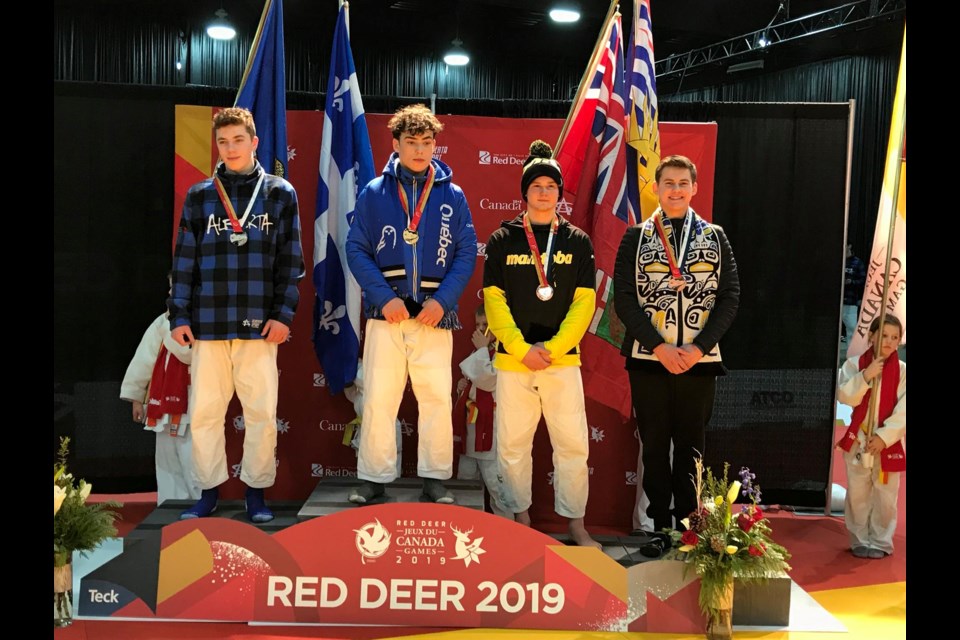 Lochlan Gary Young (right) of the Hart Judo Academy in Prince George on the podium with his bronze medal at the 2019 Canada Winter Games in Red Deer, Alberta (via Facebook/Hart Judo Academy)