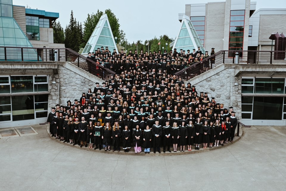 Members of UNBC's class of 2025 gather in the agora dressed in their robes for convocation day on Friday, May 30, 2025.