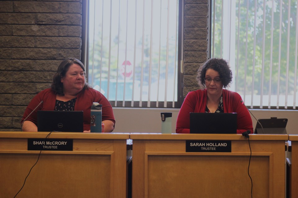 Trustees Shar McCrory (left) and Sarah Holland (right) speak during the Tuesday, June 10 meeting of the School District 57 board of trustees.