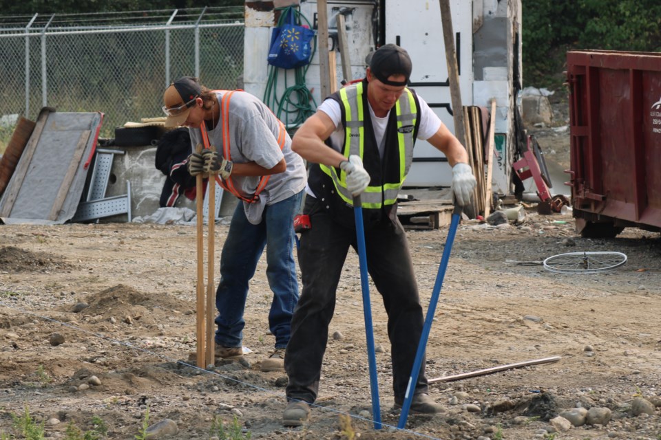 Contractors dig holes for fence posts at the eastern end of Moccasin Flats on Lower Patricia Boulevard in Prince George on Wednesday, Sept. 3, 2025.