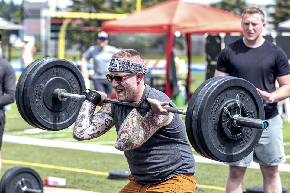 Luke Spooner, 34, struggles with a 155 lb barbell during Battle in the North 2024, a crossfit competition featuring intense fitness challenges for individuals and teams held at Masich Place Stadium on Saturday, June 8 and Sunday, June 9.