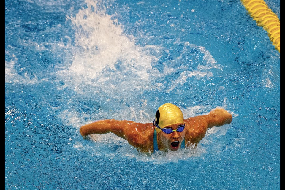Pisces swimmer Justine Guillet pulls herself though the water during her butterfly leg of a 200 Medley Relay preliminary heat Friday, August 15, 2025 during the BCSSA 2025 Provincial Championships at the Aquatic Centre.