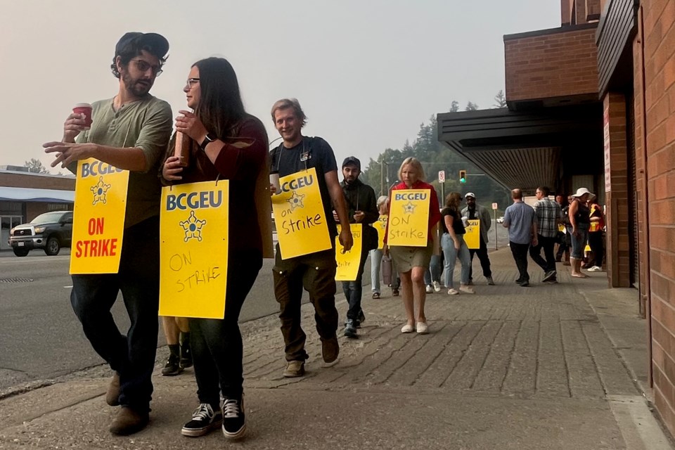 Members of the BC General Employees Union walk the picket line on Queensway outside the BC government building on the first day of their strike on Tuesday, Sept. 2, 2025 in Prince George, BC.