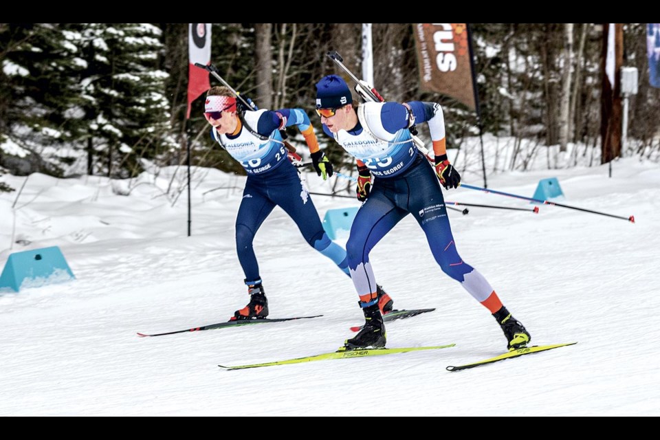Foothills Nordic teammates #26 Justin Konoff and #25 Luke Holshoff race across the flats to the shooting range in Tuesday's youth men mass start race at Otway Nordic Centre.