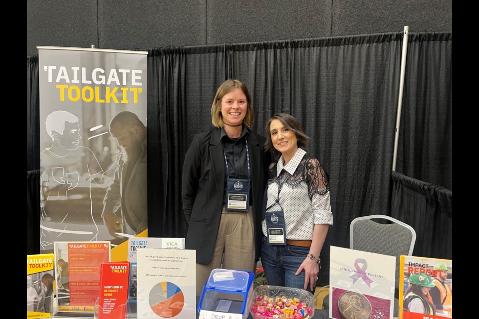 Emille Wells (left) and Mika Dumont (right) pose for a picture behind the Tailgate Toolkit booth during the Build the North Conference Wednesday, April 9, 2025 in Prince George, BC.