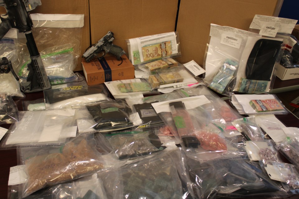 Prince George RCMP display fentanyl and cash seized during drug raids earlier in June on Tuesday, June 24, 2025 in Prince George, BC