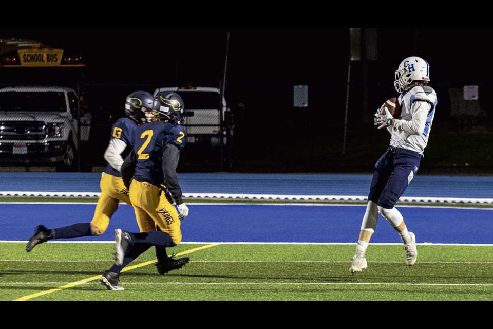 CHSS Cougar Zach Loewene #2 pulls the ball to his chest after catching a pass just prior to crossing into the endzone for the Cougars' first touchdown against NVSS Friday at Masich Place Stadium.