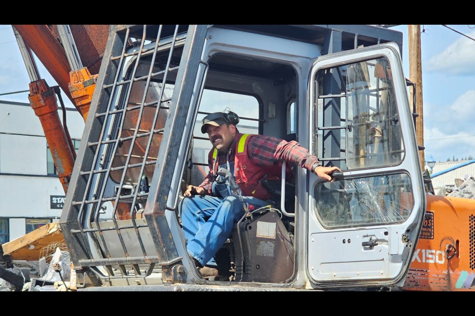 Jordan Steblin of Stubbs Contracting works to clear the debris from the site of the former City Surplus store at the corner of Fourth Avenue and Dominion Street on Friday, June 6, 2025 in Prince George, BC. 