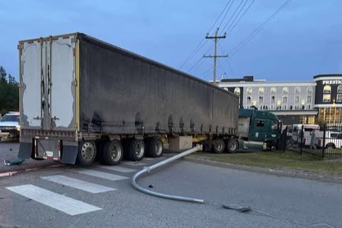 A tractor-trailer is seen shortly after striking the fence outside of Treasure Cove Casino on Tuesday, June 3, 2025 in Prince George, BC.