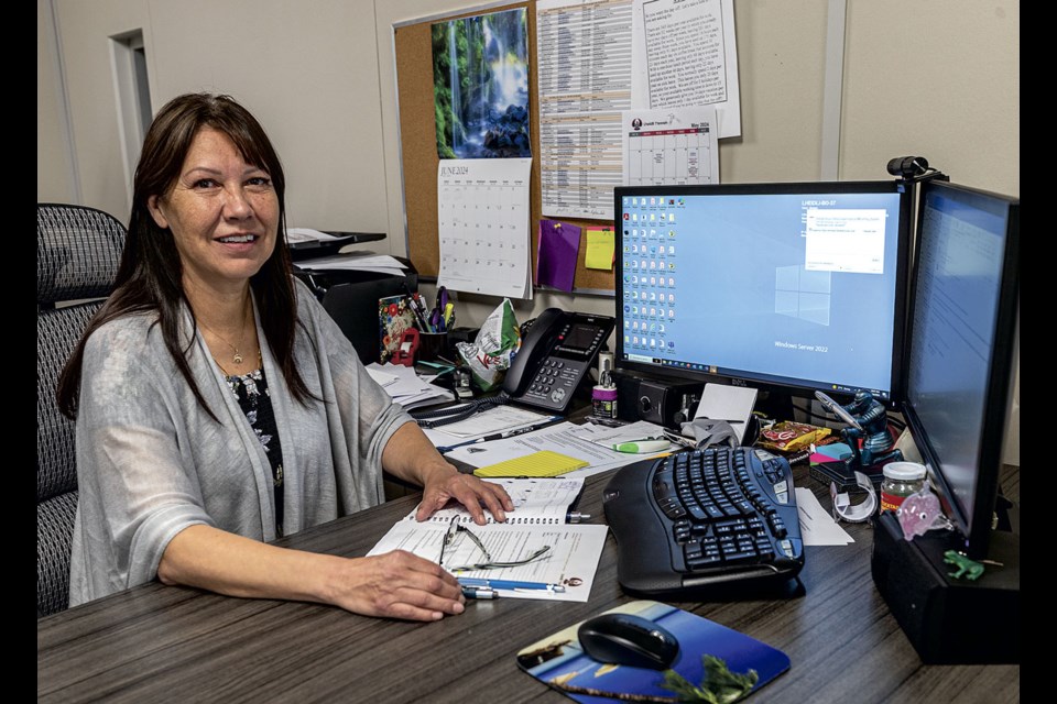 Lheidli T'enneh Chief Dolleen Logan works in her desk at the band office on Brunswick Street.