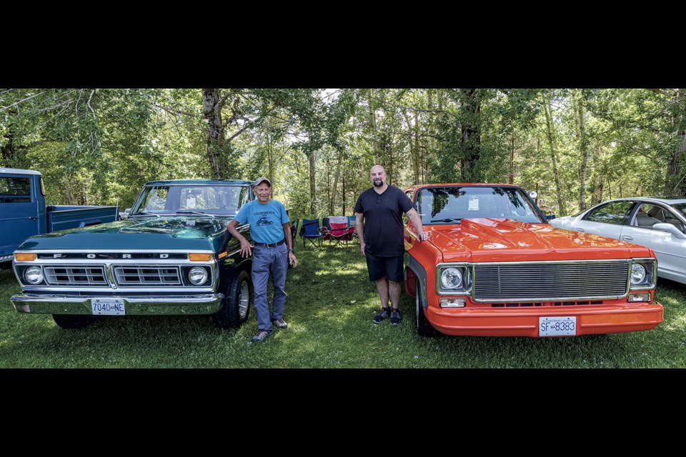 Don Martin and grandson Brett Colebank stand by their trucks, a 1977 Ford F100 Stepside and a 1977 GMC C15, at the Cruisin' Classics Father's Day Show 'n' Shine at Lheidli T'enneh Memorial Park Sunday, June 15, 2025.