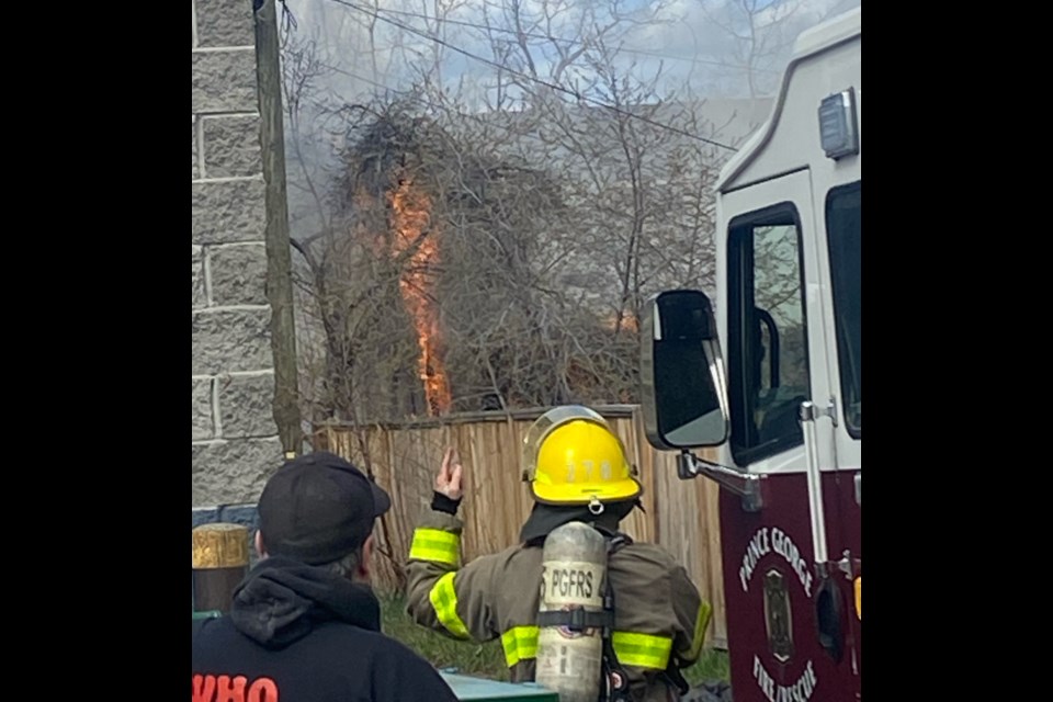 City firefighters deal with a shed fire on a Johnson Street property on Saturday, May 4, 2024 in Prince George, B.C.