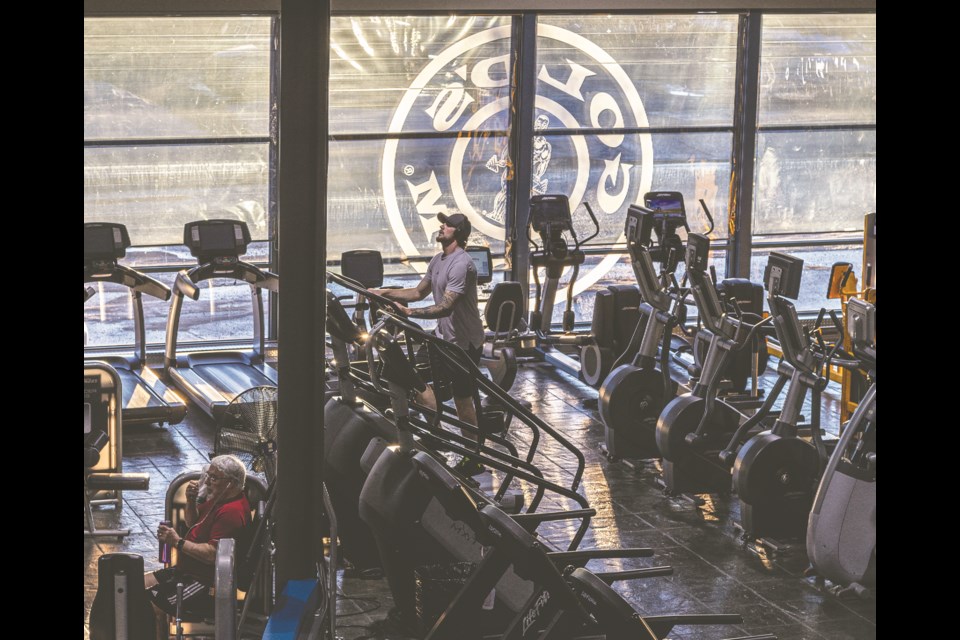 Adam Quinn takes advantage of a quiet afternoon at Gold's Gym to start his workout on a stair climber Wednesday.