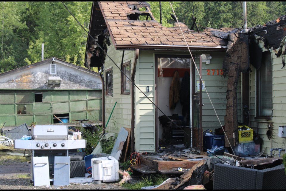 The side entrance of a building on Gunn Road was damaged by fire on Thursday, Aug. 14, 2025 in Prince George, BC.