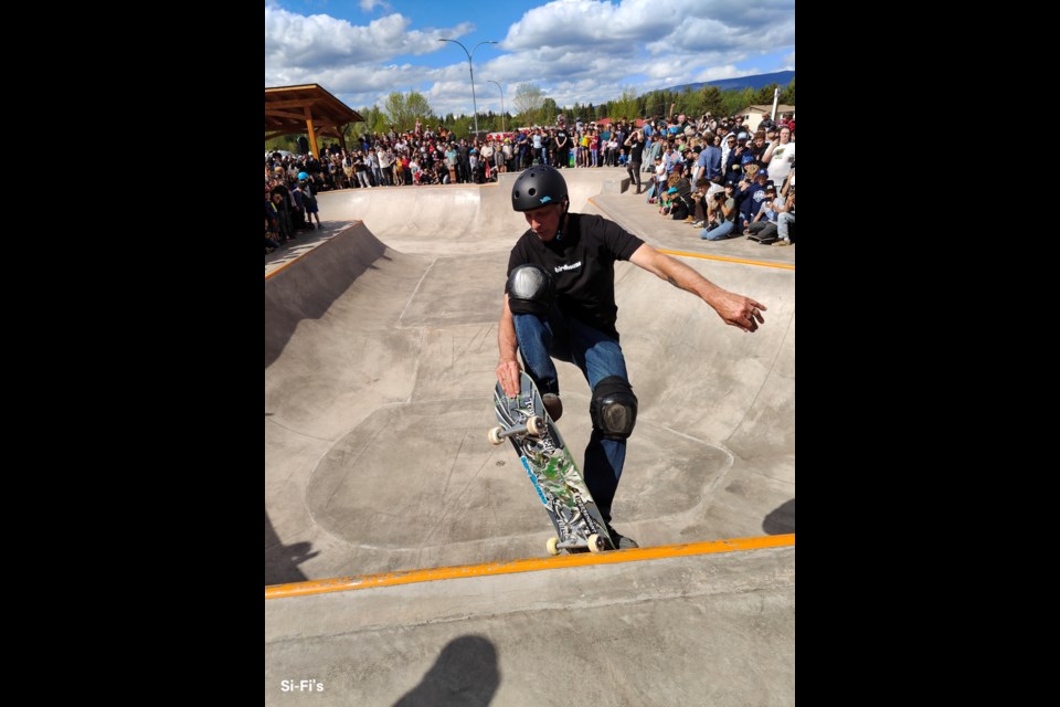 Tony Hawk skates in front of onlookers at the opening of the Smithers Skatepark expansion on May 29, 2025.