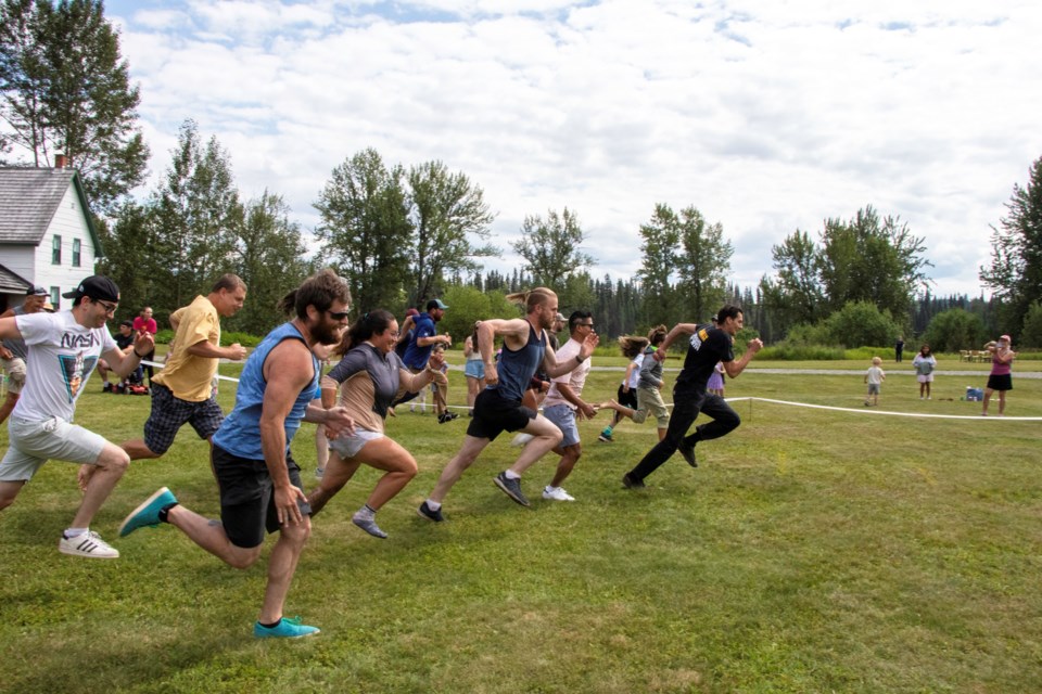 Adults take part in a foot race at last year's Homestead Day's event. 