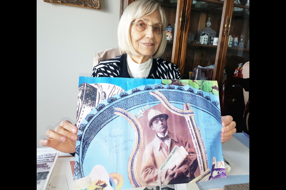 Nada Newell of Prince George holds a poster of her father, Franjo Ledic, whose work as a Yugosalvian film pioneer and movie studio owner was featured in an art exhibit in Zagreb, Croatia.