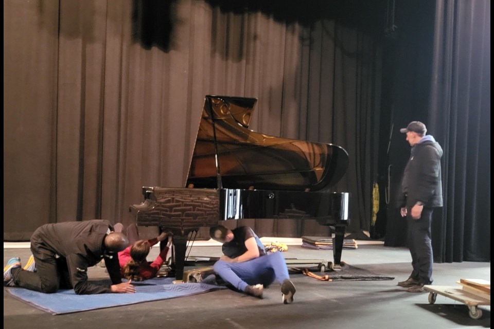 The nine-foot Bechstein grand piano was moved from Vanier Hall to its new home at the Prince George Playhouse last week. The final touches of reassembly take place in this photo centre stage at the Playhouse.
