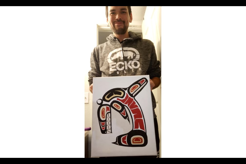 Brad Cecil, local First Nations artist who overcame homelessness, displays his most recent work The Whale.