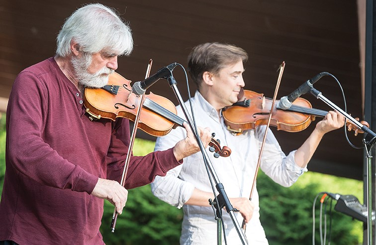 Gordon Stobbe, left, and JJ Guy, right, of Twin Fiddles perform in front of nearly one-hundred fiddle fans on Saturday evening at the Kiwanis Bowl in Lheidli T'enneh Memorial Park. The Twin Fiddles concert was hosted by the Prince George branch of the B.C. Old Time Fiddler's Association.