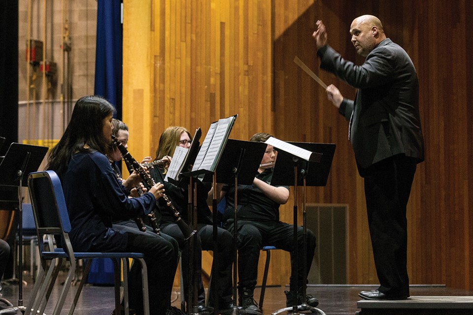 Citizen Photo by James Doyle. The College Heights Secondary Grade 8 Concert Band performs on stage at Vanier Hall on Thursday evening during the 2022 MusicFest Fanfare Showcase.