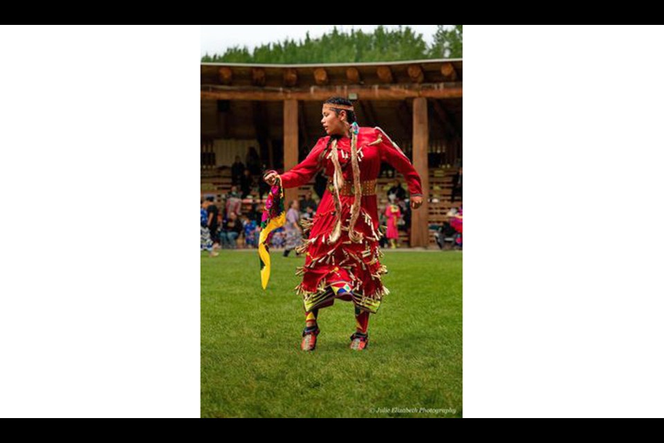 Bella Rain Abraham takes part in the junior girls jingle dress competition at the 2023 Kamloopa Powwow