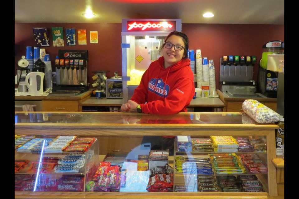 This is the friendly face that greets customers as they walk into the Grand Reo Theatre in Vanderhoof. Aiyana Wallace is standing behind the concession in the 100-year-old building.