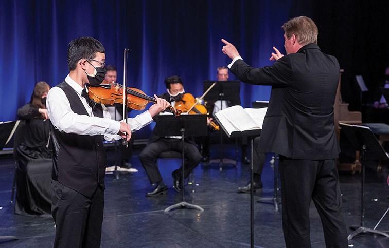 Citizen Photo by James Doyle/Local Journalism Initiative. 12-year-old Luke Chen solos on stage with the Prince George Symphony Orchestra as they recorded their final concert of the season, a presentation titled Splendorous Spring, on Saturday evening at Studio D.