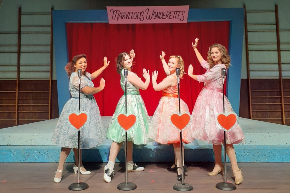 The Marvelous Wonderettes pose prettily for a photo during a press-invited preview of the show taking place at Theatre NorthWest Nov. 18 to Dec. 8. From left is Ali Watson, Maggie Trepanier, Becca Thackray, and Shelby Meaney.
