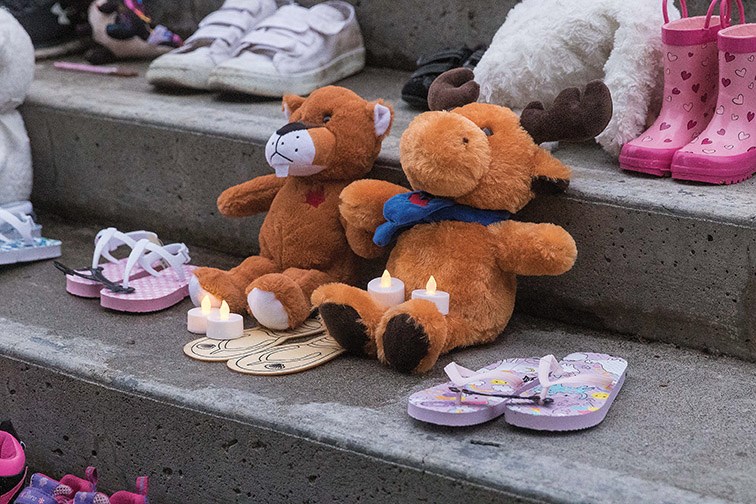 A memorial was set up on the steps of city hall in remembrance of the 215 children whose remains were found in a mass grave on the site of a former residential school in Kamloops.