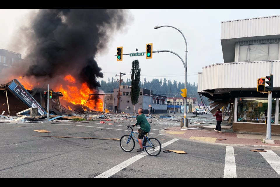 This photo by Shayne Hawley captures the chaos of Tuesday's explosion and fire that destroyed the former Achillion Restaurant at Fourth Avenue and Dominion Street.
