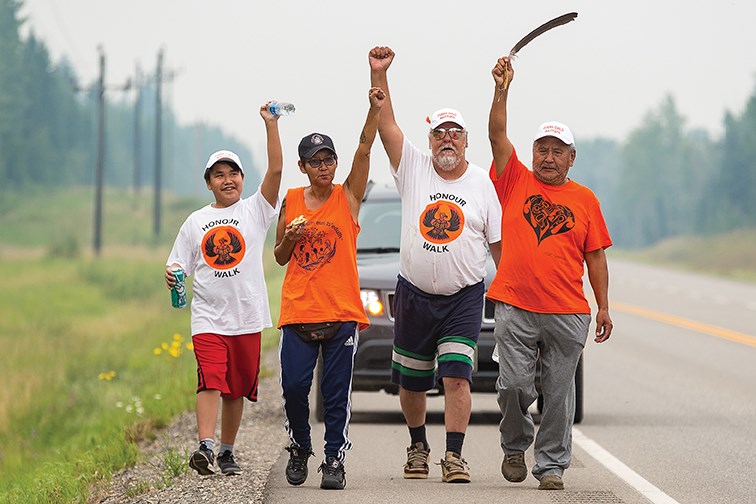 From left, Zaa Joseph from the Lheidli T'enneh, Patsy Seymour from the Lheidli T'enneh, Karle Nooski from Nadleh Whut'en, and elder Victor Joseph from Lheidli T'enneh, make their way along Highway 16 West as they head towards Prince George on Sunday while participating in the Walk Home from Lejac. The walk honored the ancestors and elders who made the journey trying to escape the residential school in Lejac. The walk started on Saturday morning at 10 a.m. from the site of the former residential school in Lejac and finished at the bandshell in Lheidli T'enneh Memorial Park at 4:30 p.m on Sunday afternoon.