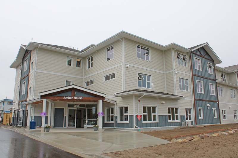 The development contains transition housing on the first floor and second stage apartment housing on the second and third floors. 