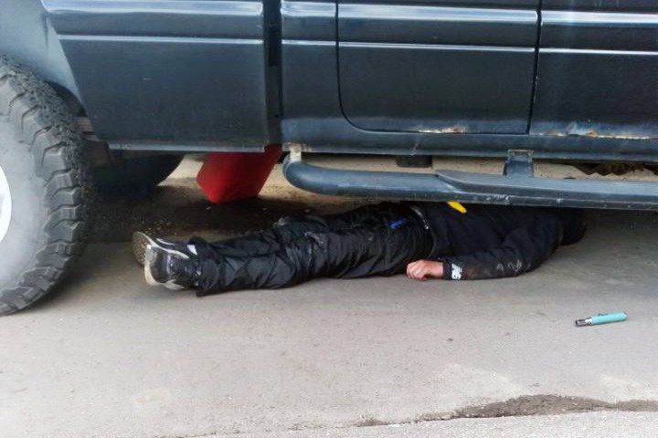 Nechako Brake & Wheel employee Steve Seebach shot this photo of an unconscious man in the act of stealing gas from fuel tanks Sept. 8 in the lot of the downtown auto repair shop.