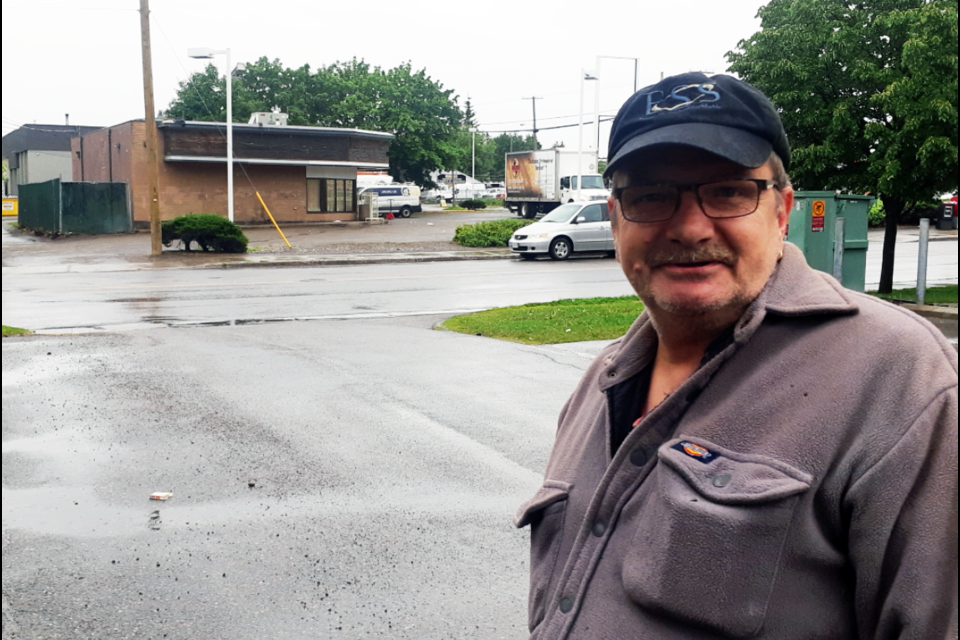 Brian Gilliard is hoping the closure of the 7-Eleven convenience store, shown in the background, will eliminate some of the problems he faced over the past two years as property manager of two neighbouring apartment buildings. 